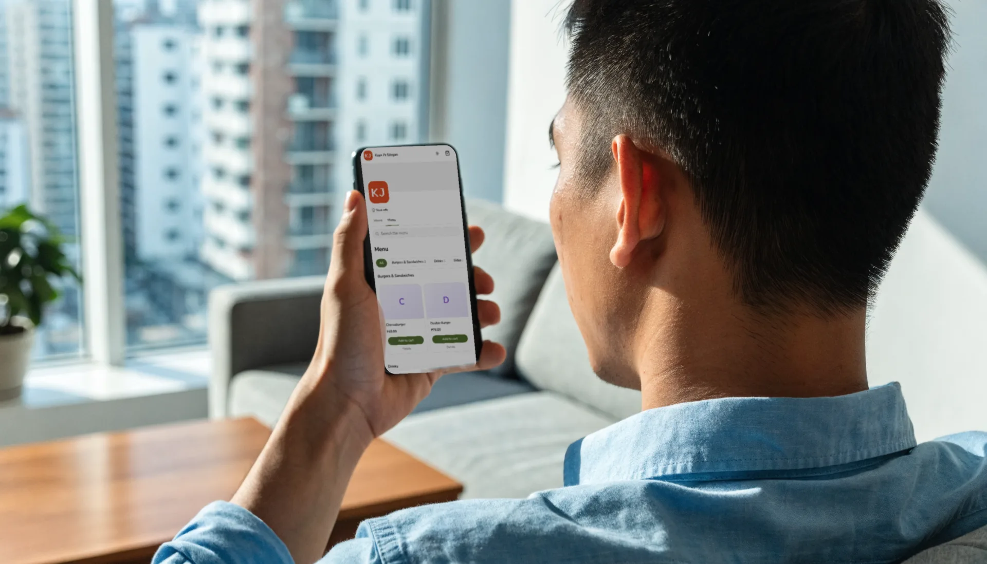 A customer on his sofa browses a seller’s store link menu on his phone, picking his dinner order in the browser.