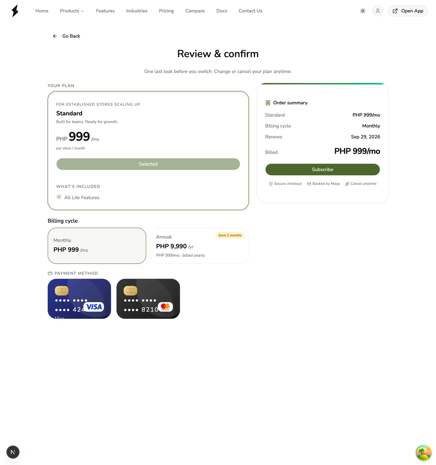 The Review and confirm screen in Fuze Store showing a lower plan selected, its order summary, billing cycle choice, and payment method section